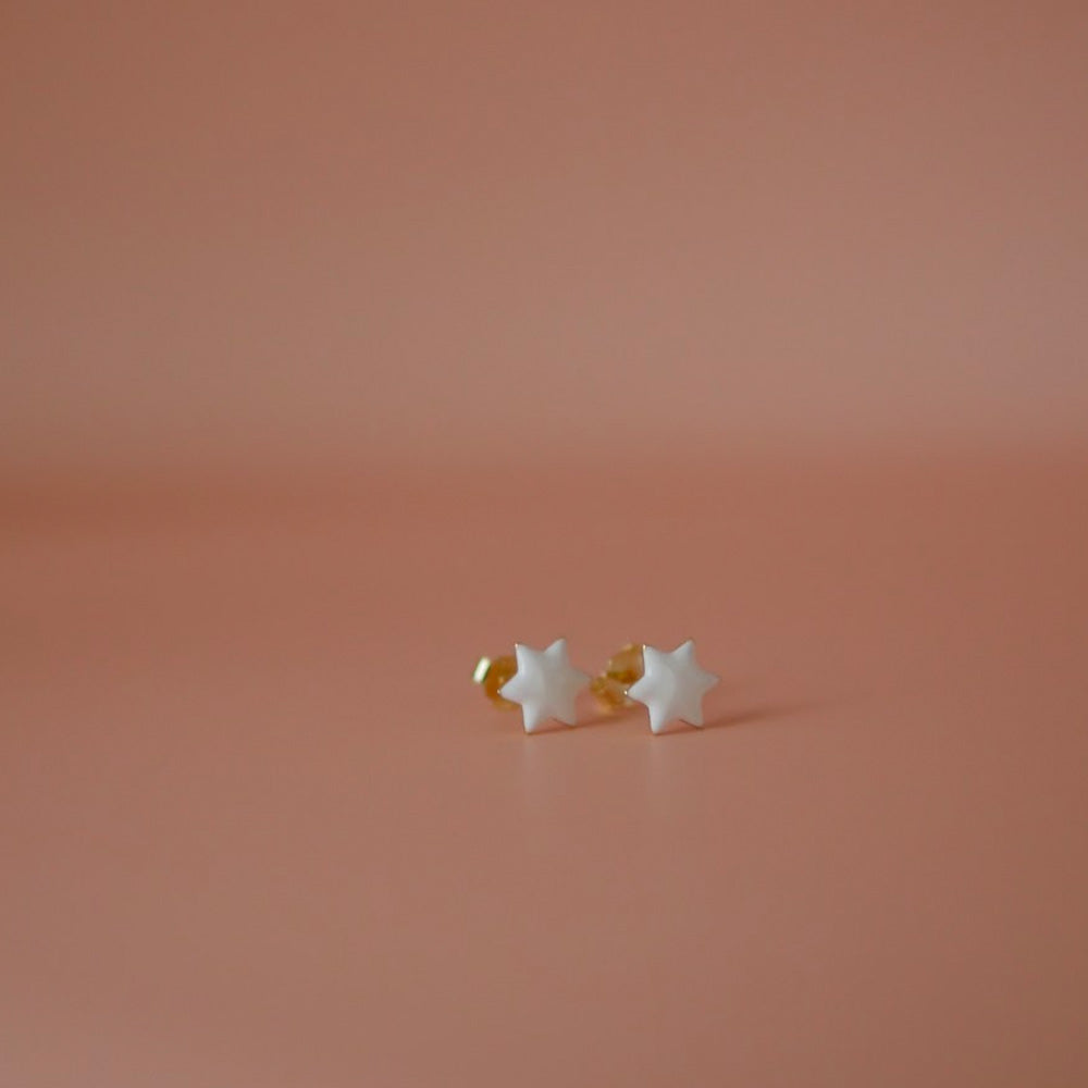 White pair of Jewish star studs in enamel