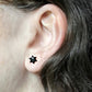 Black pair of Jewish star studs in enamel on model