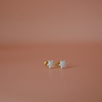 White pair of Jewish star studs in enamel